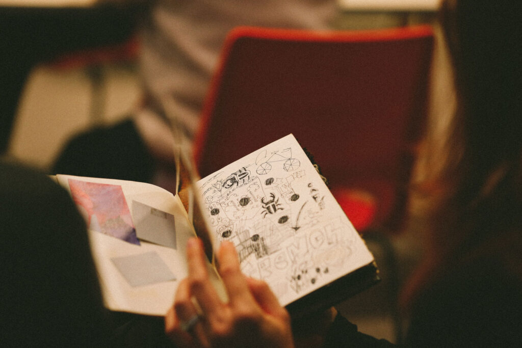 A person turns the pages of a book