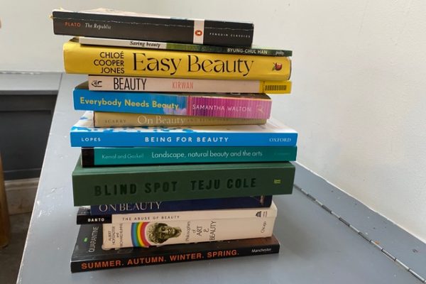 A small stack of books with spines showing, very colourful